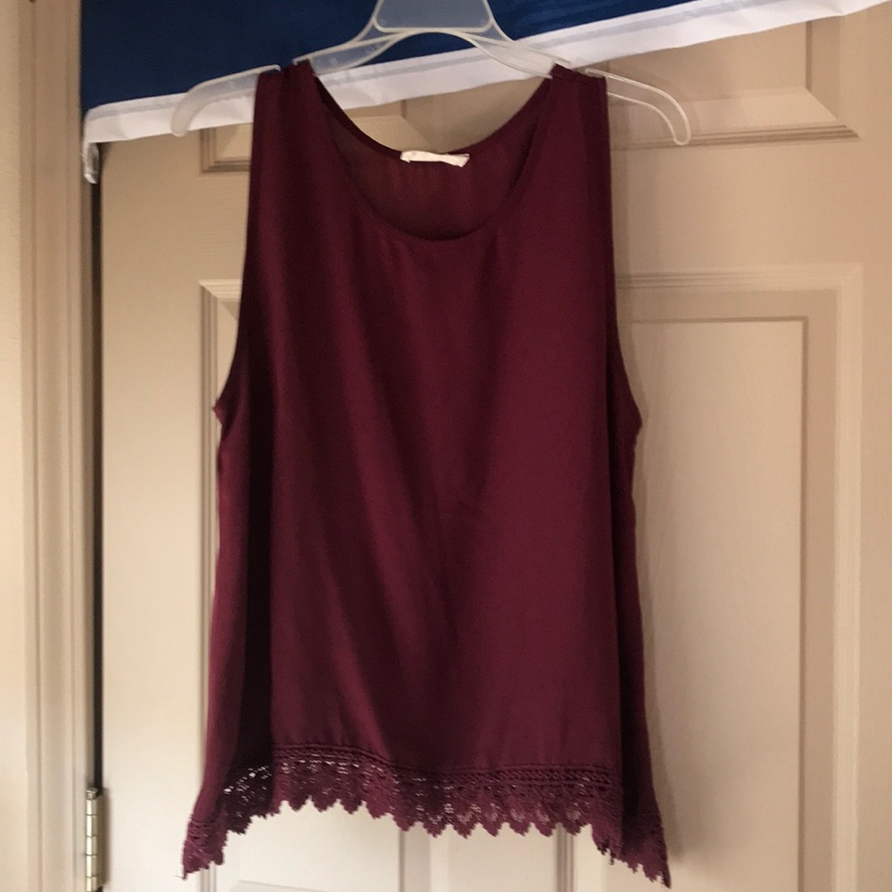 Maroon tank with lace bottom.